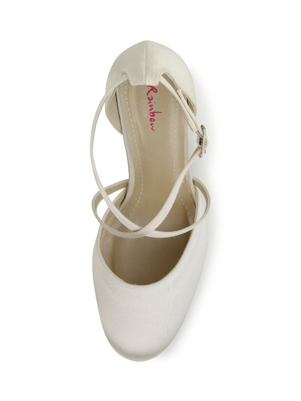White shoe with thin strap on a white background